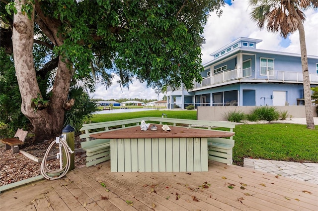 exterior space with a front yard and a deck