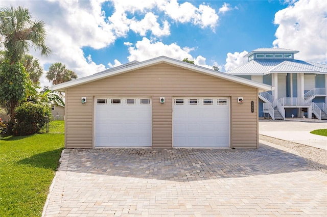 garage featuring a yard