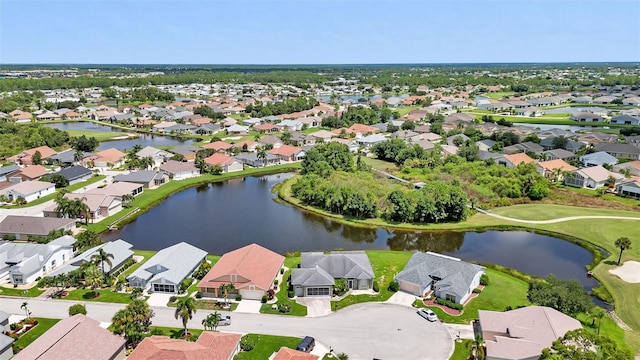aerial view with a residential view and a water view