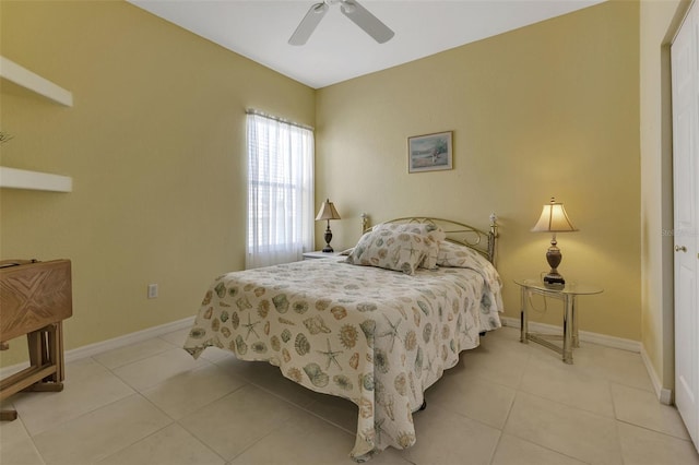 bedroom featuring a ceiling fan, baseboards, and light tile patterned flooring