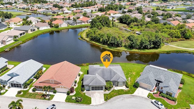 aerial view featuring a residential view and a water view