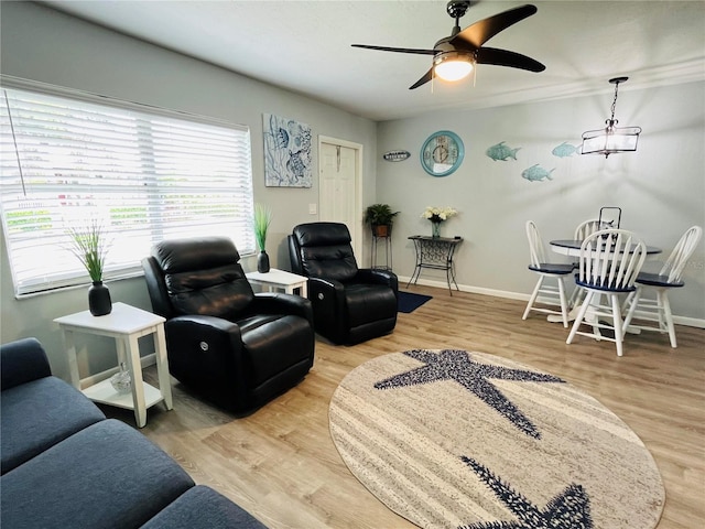 living room featuring ceiling fan and wood-type flooring