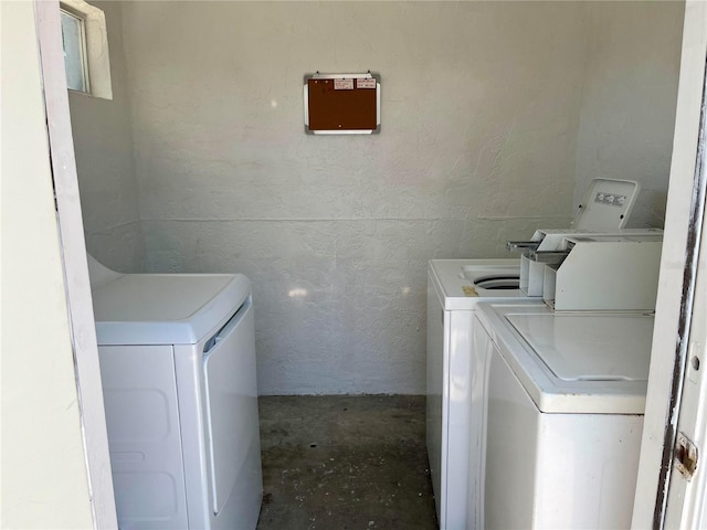 laundry area featuring washing machine and clothes dryer