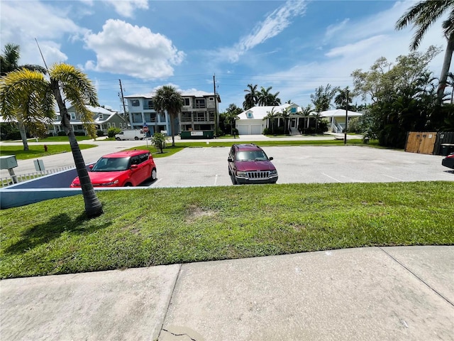 view of vehicle parking featuring a residential view