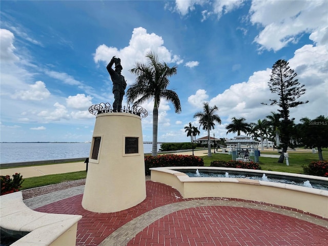 view of community with a water view