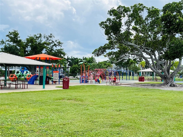 exterior space with a playground and a lawn