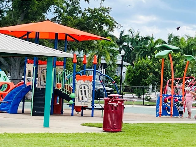 view of playground featuring a lawn