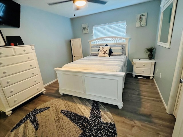 bedroom featuring dark wood-type flooring and ceiling fan