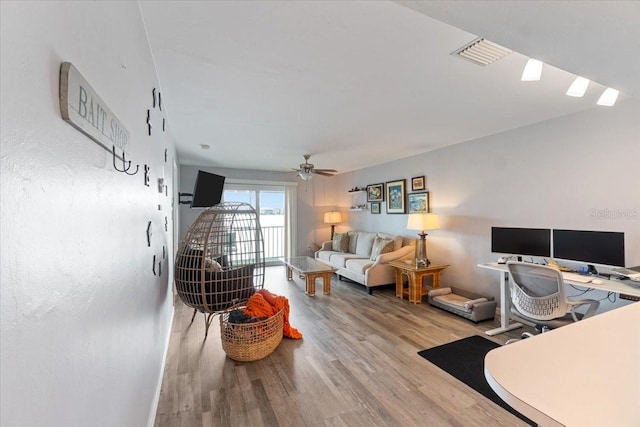 office space featuring ceiling fan and hardwood / wood-style flooring