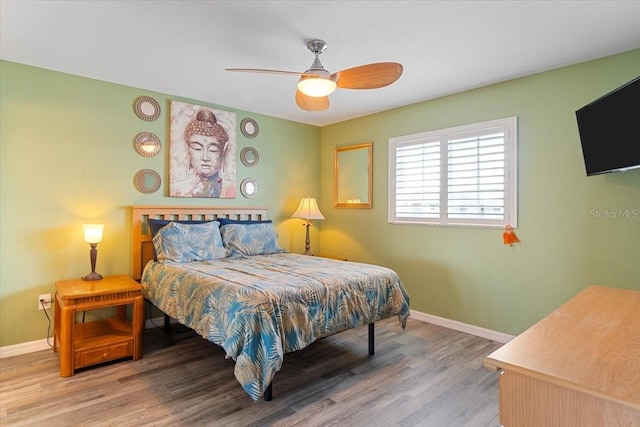 bedroom featuring ceiling fan and hardwood / wood-style floors