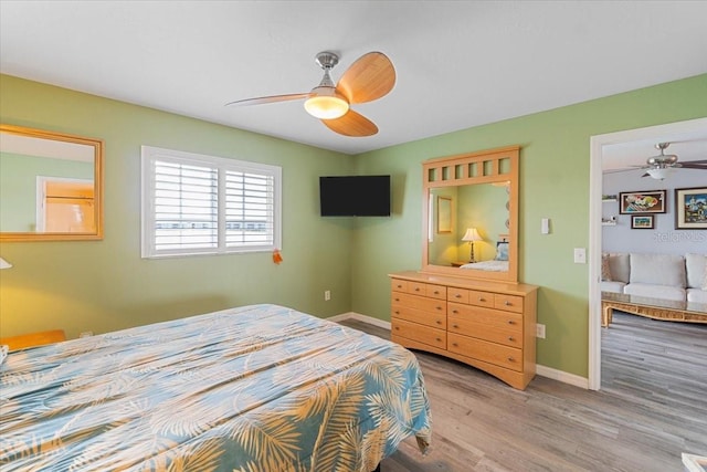 bedroom featuring light hardwood / wood-style flooring and ceiling fan