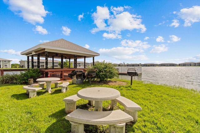 view of yard featuring a water view and a gazebo