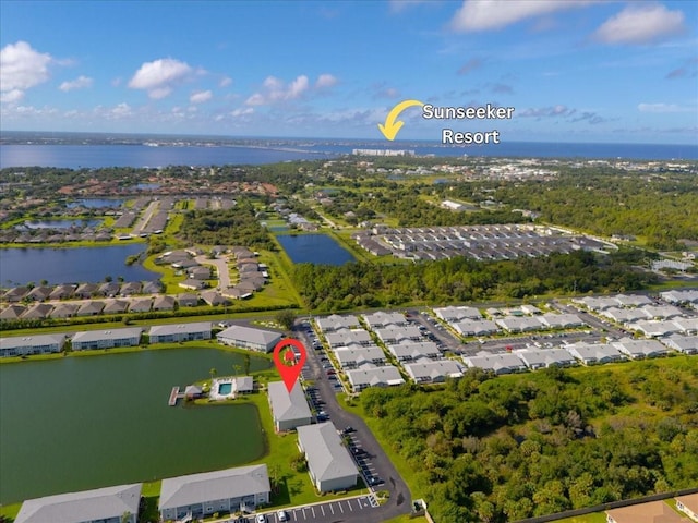 birds eye view of property featuring a water view and a residential view