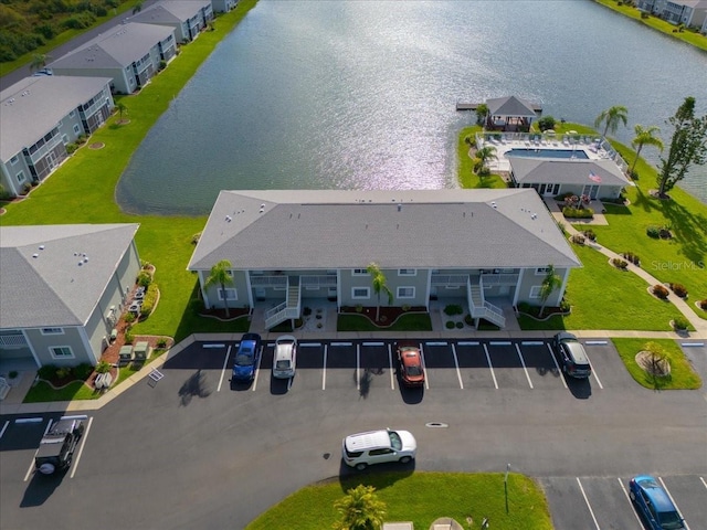 birds eye view of property with a residential view and a water view