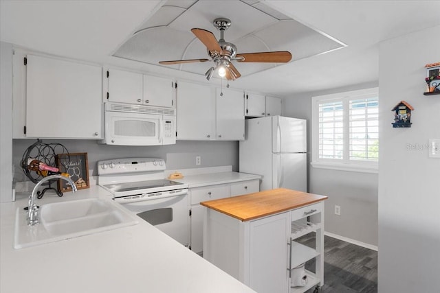 kitchen with ceiling fan, sink, white appliances, and white cabinets