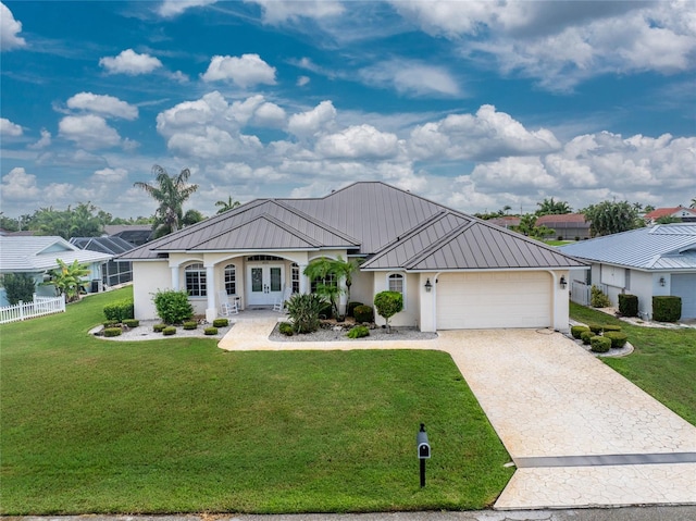 view of front facade with a garage and a front lawn