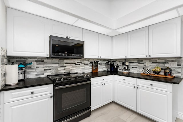 kitchen featuring white cabinetry, backsplash, and black electric range