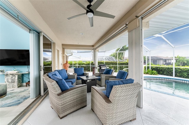 view of patio / terrace with glass enclosure, an outdoor living space, and ceiling fan