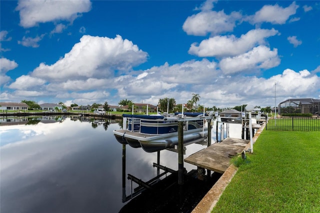 dock area with a yard and a water view