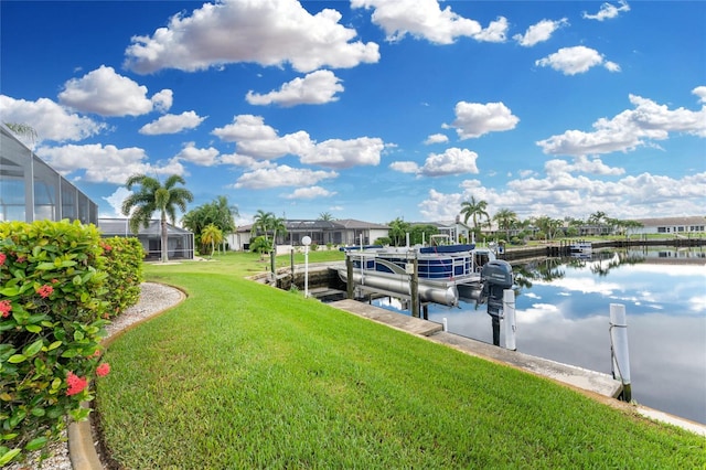 dock area featuring a lanai, a yard, and a water view