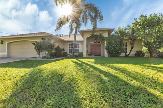 mediterranean / spanish-style house featuring a front yard and a garage