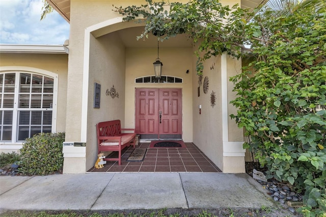 view of exterior entry featuring a porch