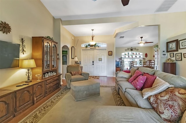 living room featuring ceiling fan and wood-type flooring