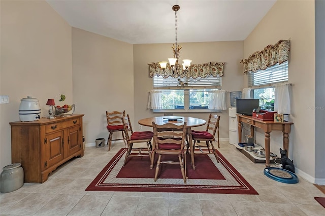 dining area with a healthy amount of sunlight, a chandelier, and light tile patterned flooring