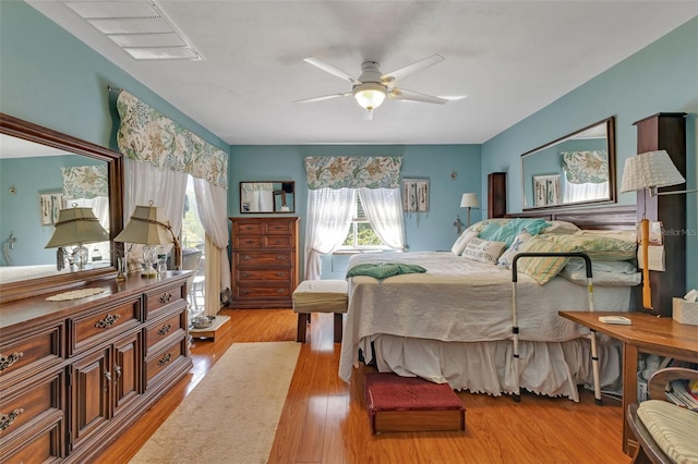 bedroom with light wood-type flooring and ceiling fan