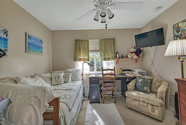 bedroom with ceiling fan and light carpet