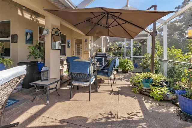 view of patio / terrace featuring a lanai