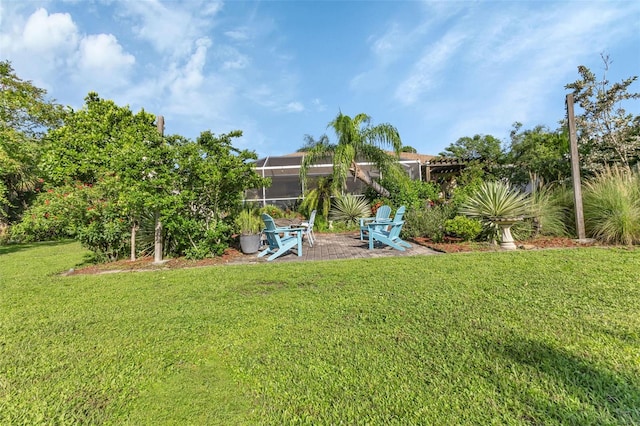 view of yard featuring a lanai and a patio