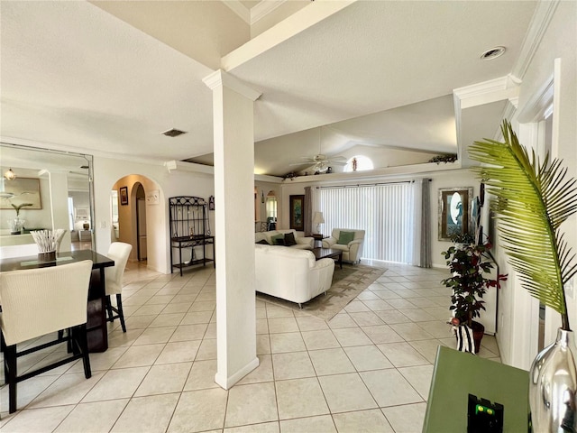 tiled living room with a textured ceiling, crown molding, ceiling fan, and vaulted ceiling