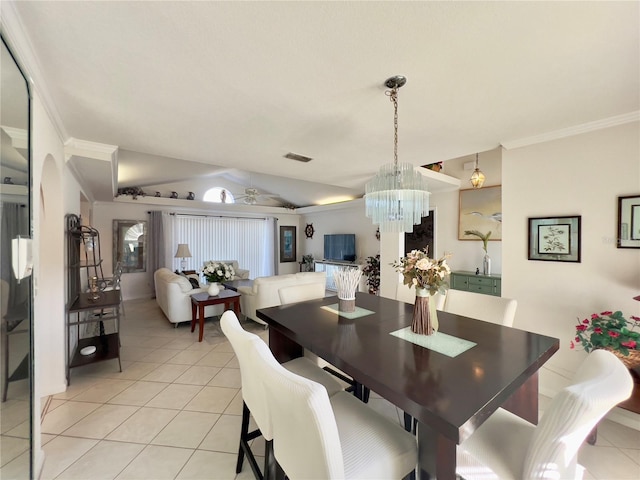 dining area with crown molding, lofted ceiling, a chandelier, and light tile patterned flooring