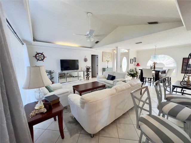 tiled living room featuring a raised ceiling, ceiling fan, and vaulted ceiling