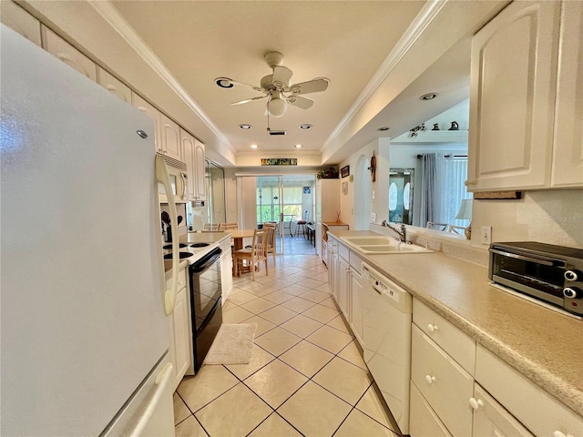 kitchen featuring white appliances, crown molding, sink, ceiling fan, and light tile patterned flooring