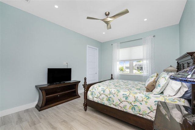 bedroom with light wood-type flooring and ceiling fan