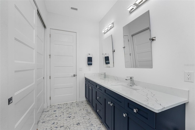 bathroom featuring tile patterned floors and vanity