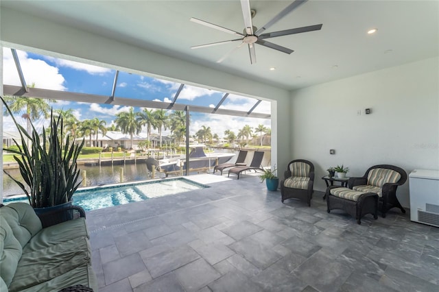 interior space featuring a water view and ceiling fan