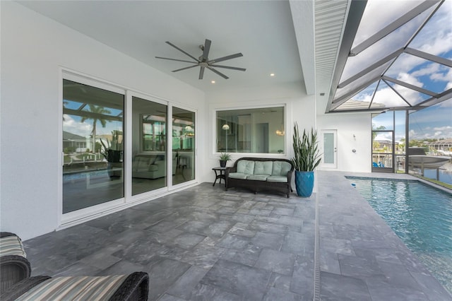 view of patio / terrace featuring glass enclosure and ceiling fan