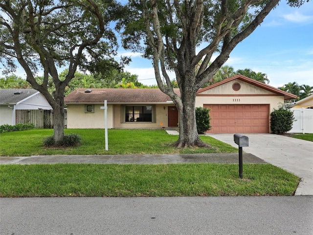 single story home with a front yard and a garage