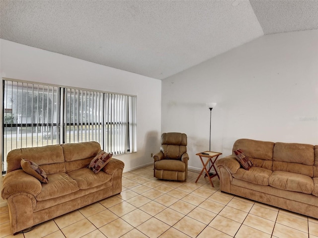 tiled living room featuring a textured ceiling, plenty of natural light, and lofted ceiling