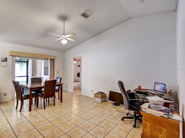 tiled office space with a textured ceiling, ceiling fan, and lofted ceiling