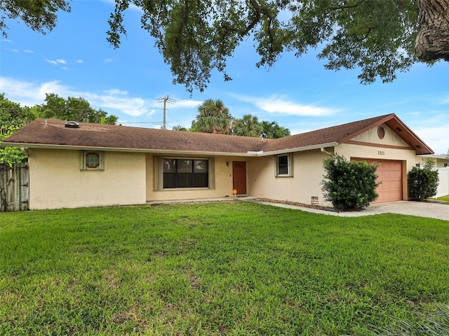 ranch-style house with a garage and a front lawn