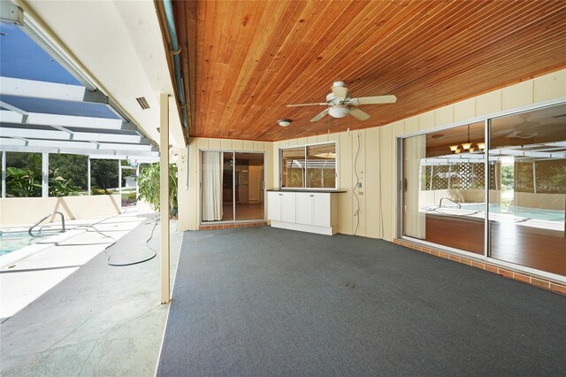 view of patio featuring ceiling fan