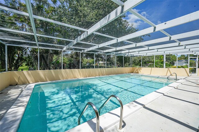 view of pool with a lanai