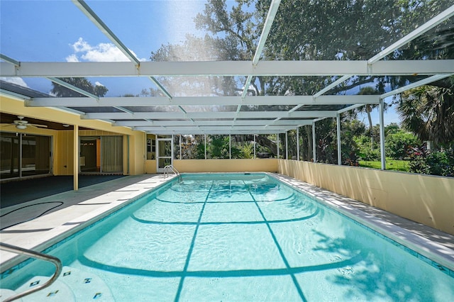 outdoor pool with a patio area and a lanai