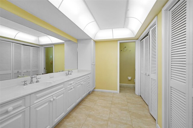 bathroom featuring tile patterned floors, toilet, and vanity