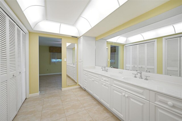 bathroom featuring tile patterned flooring and vanity