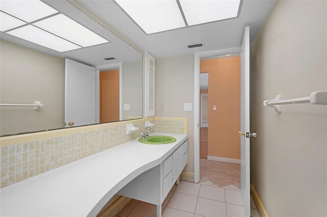 bathroom with vanity, tile patterned floors, and decorative backsplash